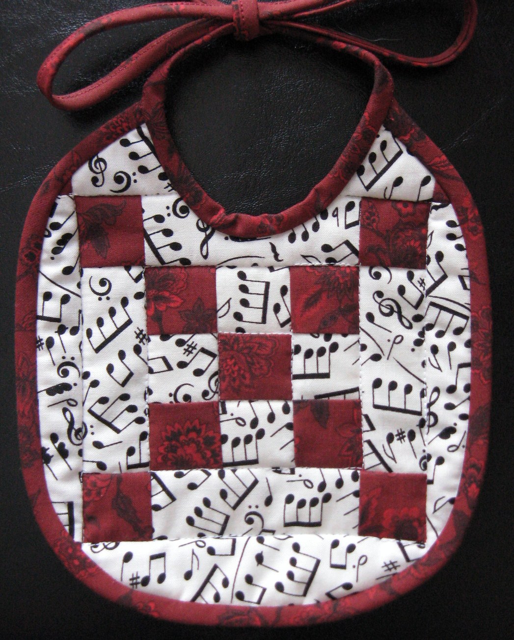 Nine-patch quilted baby bib